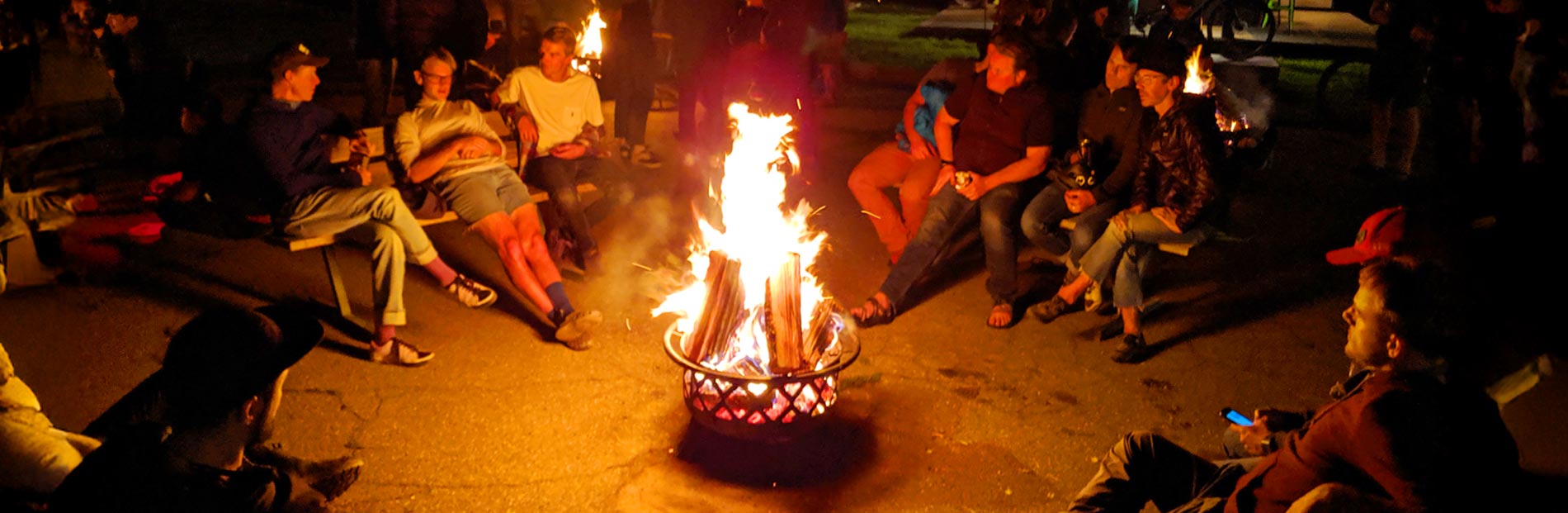People warming themselves next to a fire