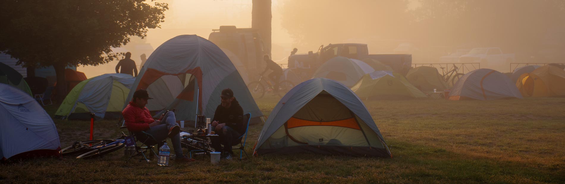 Large group of tents and people on the festival grass