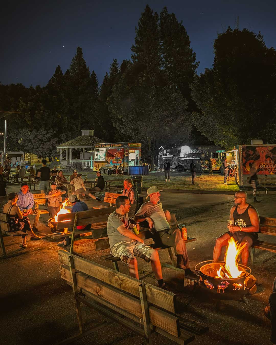 People sitting together around fire pit